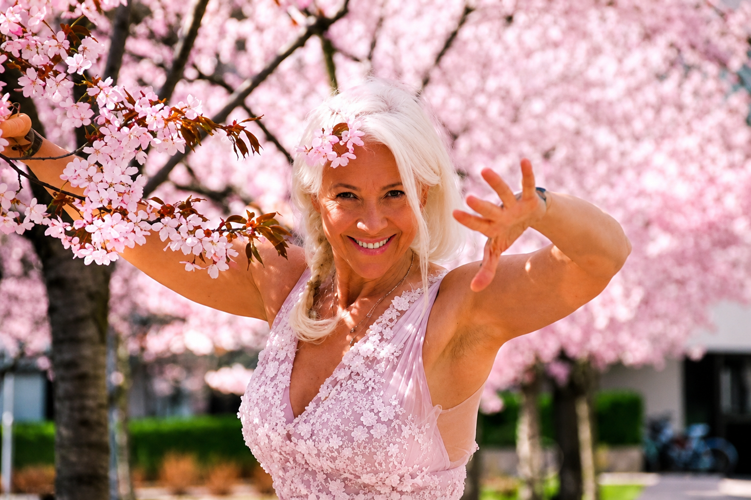 Lina expressing movement among spring blossoms